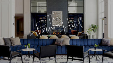 Lobby of Forum Hotel with Forum Hotel logo