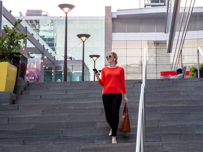 Woman walking down stairs