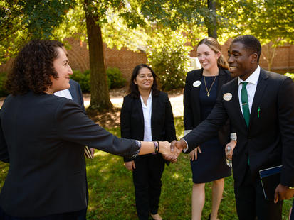 Recruiters and students shaking hands