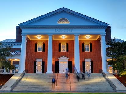 Saunders hall UVA Darden evening stairs with blurred people