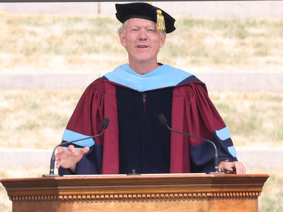 Dean Beardsley at the Lectern outdoors