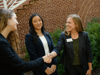 Christy Gunville, Managing Director Career Center, greeting students.