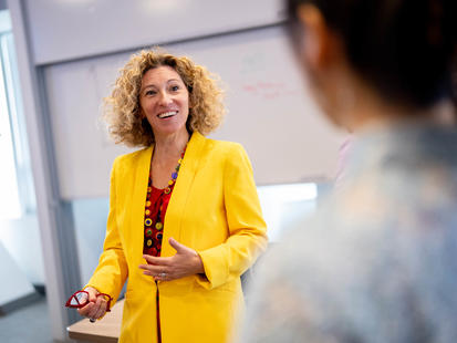 Yael talking to students