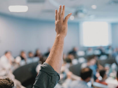 raised hand in the classroom