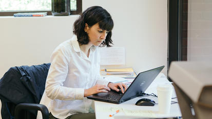 Darden Online Student working on computer