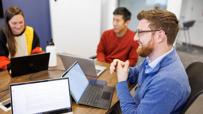 three students in learning team room