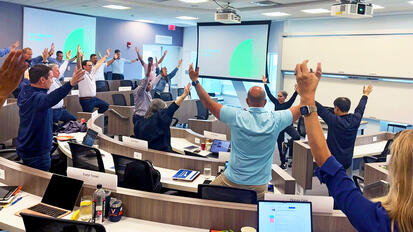 Participants stretching in classroom