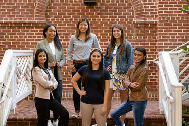 full-time mba students standing on steps at Darden