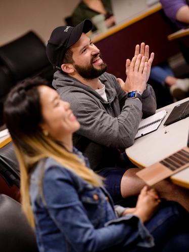 two students smiling in a darden classroom
