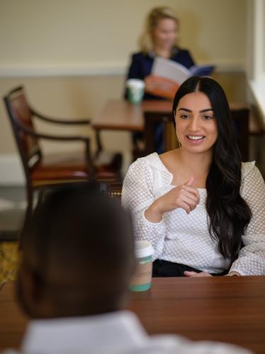 female student sitting in south lounge