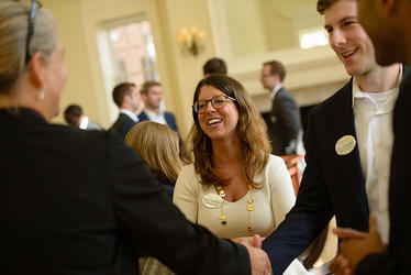 Students speaking with corporate representatives