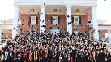 Students throw caps in air